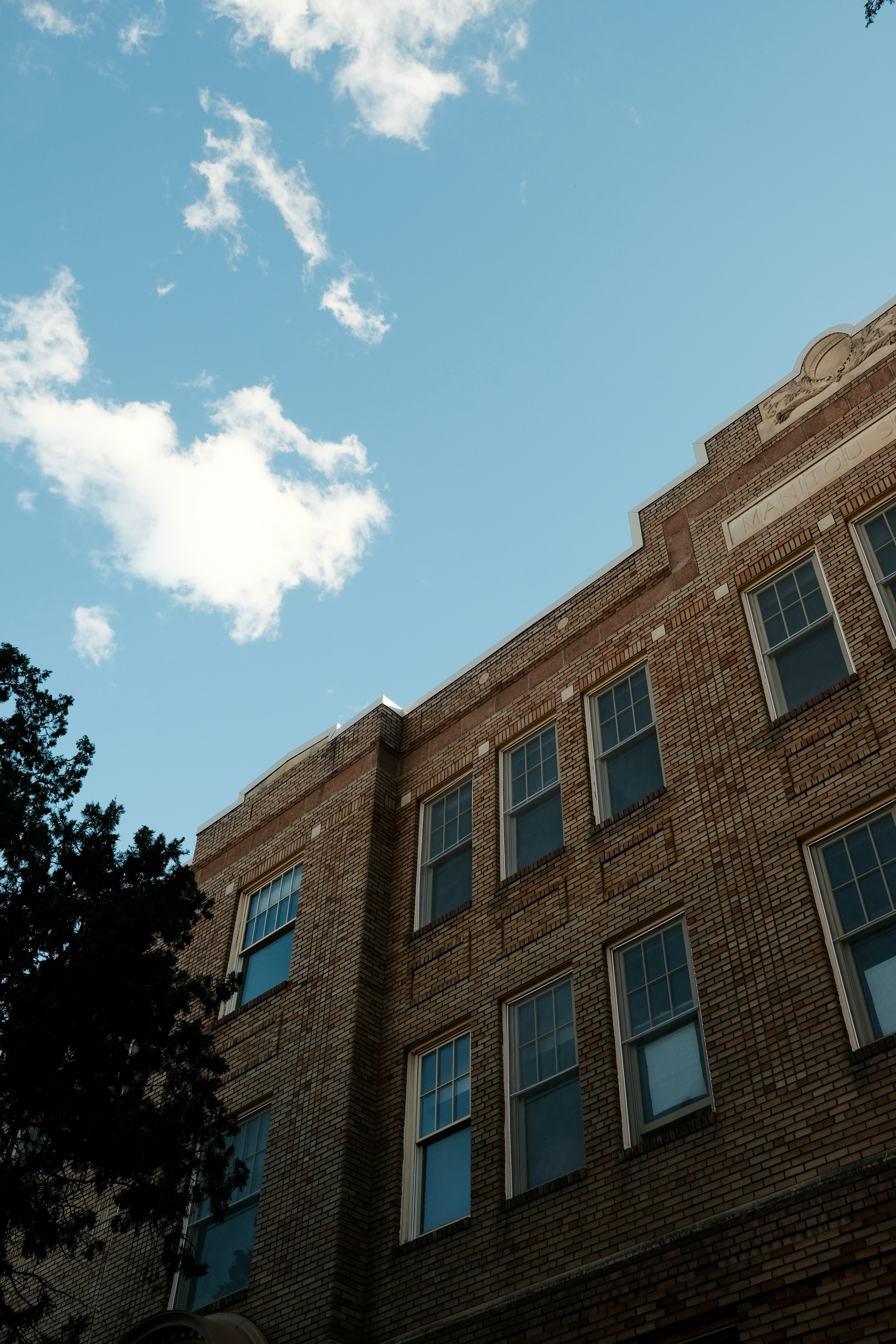 Large windows on a brick commercial building
