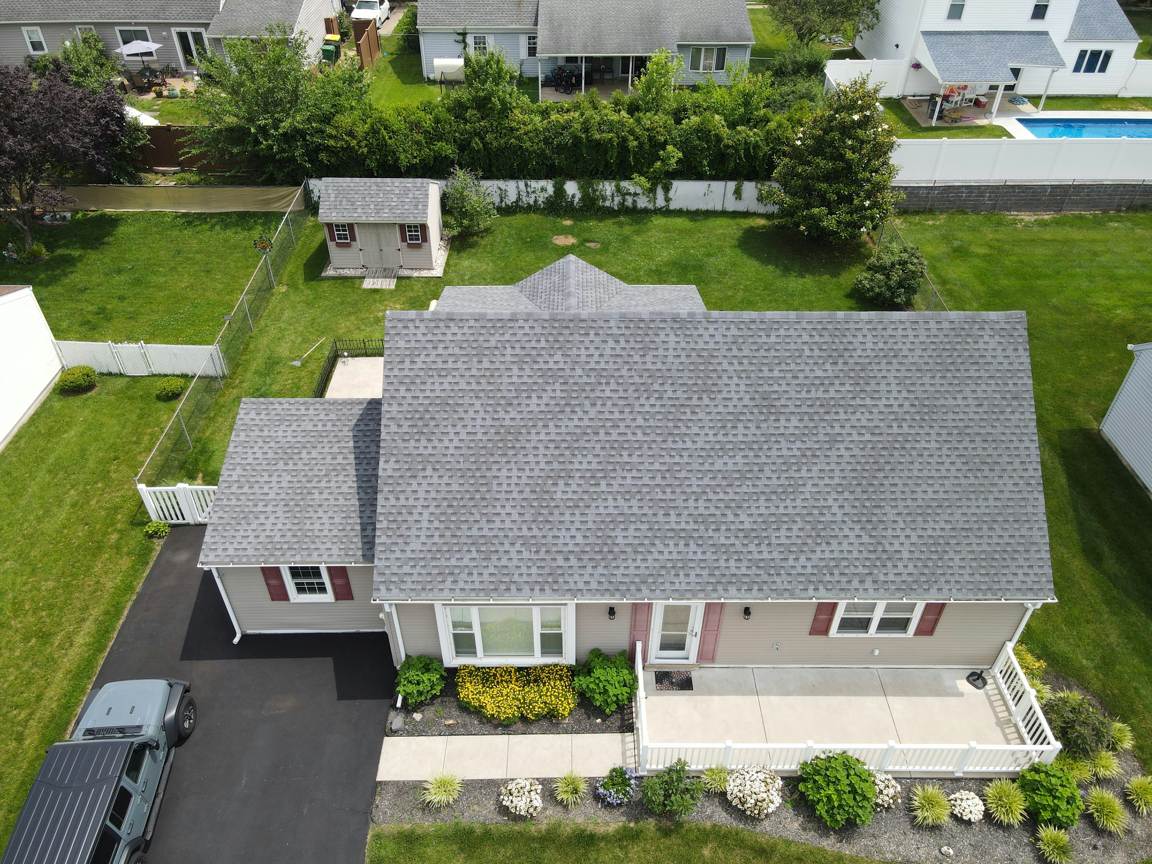 Aerial drone view of completed asphalt shingle roof