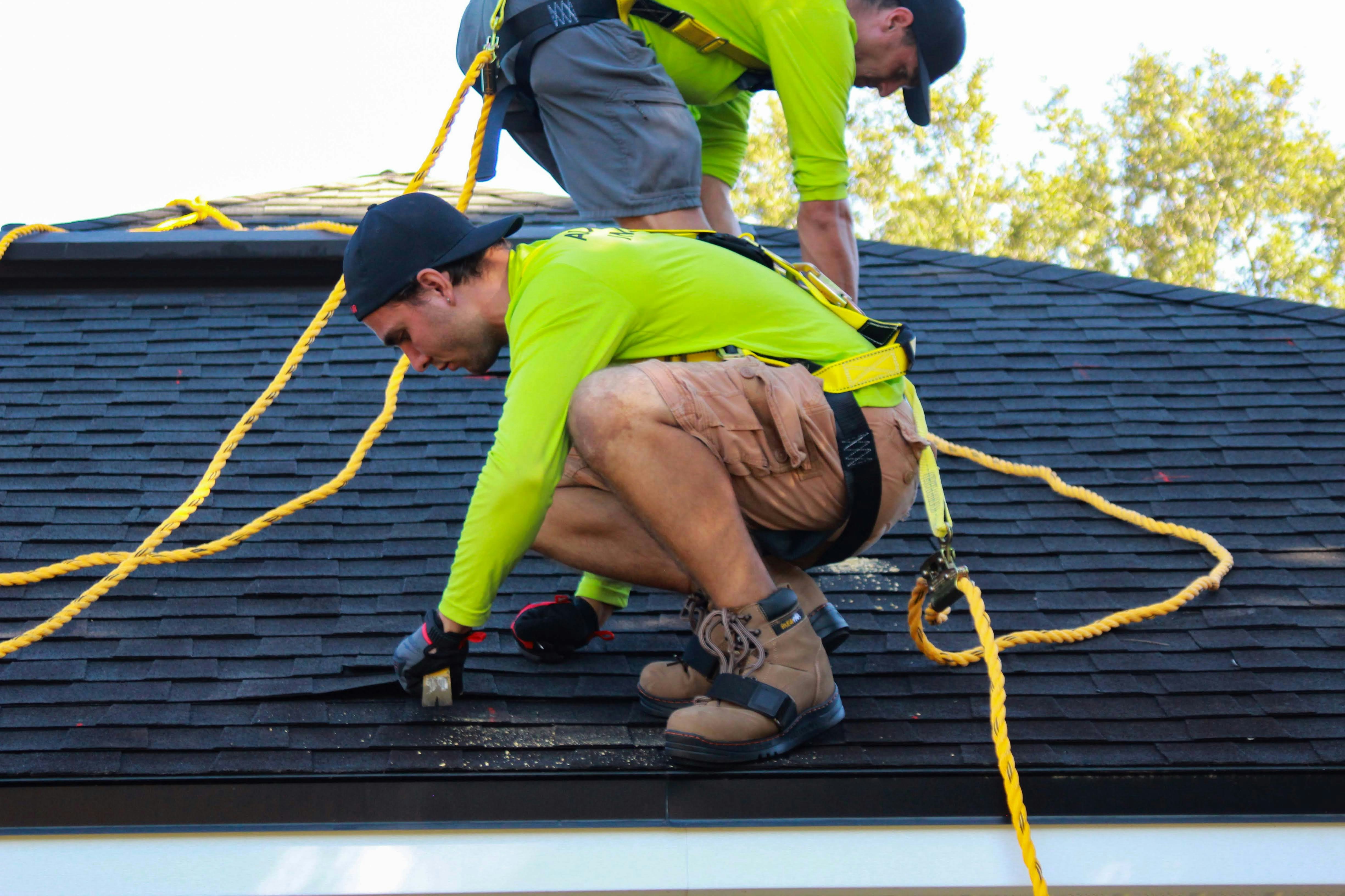Two roofers working on a residential roof — Churchville, VA